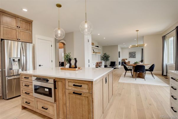 Dining room, Interior, Kitchen, Pendant Lights, Recessed Lighting, Stainless Steel Appliances, Wood Texture Flooring