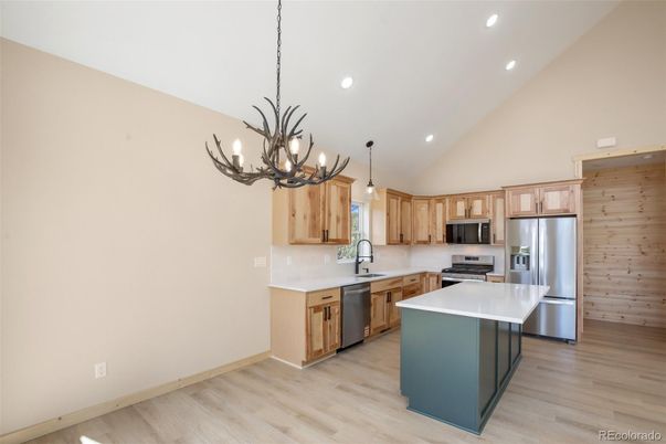 Chandelier, Interior, Kitchen, Pendant Lights, Recessed Lighting, Stainless Steel Appliances, Wood Texture Flooring