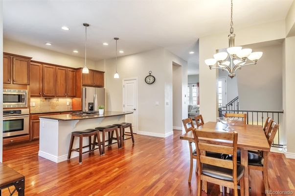 Chandelier, Dining room, Interior, Kitchen, Pendant Lights, Recessed Lighting, Stainless Steel Appliances, Wood Texture Flooring