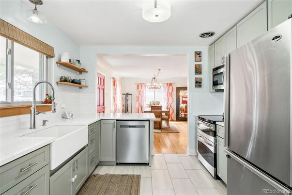 Chandelier, Dining room, Interior, Kitchen, Pendant Lights, Stainless Steel Appliances, Wood Texture Flooring