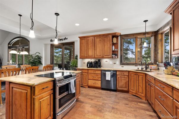 Dining room, Interior, Kitchen, Pendant Lights, Recessed Lighting, Stainless Steel Appliances, Wood Texture Flooring