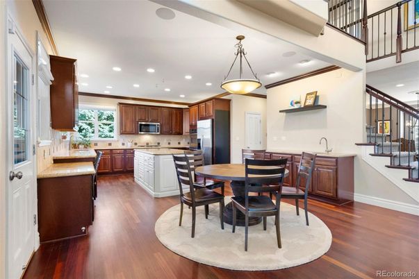 Dining room, Interior, Kitchen, Pendant Lights, Recessed Lighting, Stainless Steel Appliances, Wood Texture Flooring