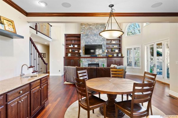 Dining room, Fireplace, Interior, Pendant Lights, Recessed Lighting, Stone Walls, Wood Texture Flooring