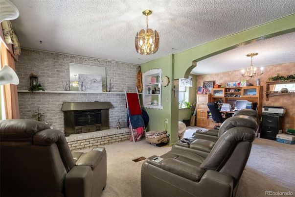 Chandelier, Dining room, Fireplace, Interior, Living room, Stone Walls