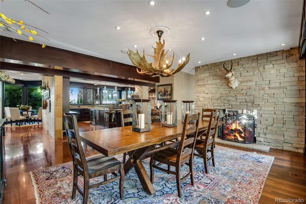 Chandelier, Dining room, Fireplace, Interior, Recessed Lighting, Stone Walls, Wood Texture Flooring