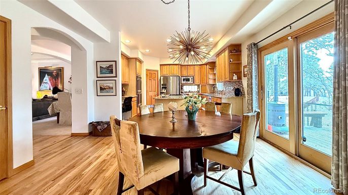 Dining room, Interior, Kitchen, Pendant Lights, Recessed Lighting, Stainless Steel Appliances, Wood Texture Flooring