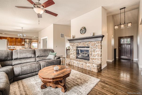 Chandelier, Fireplace, Interior, Kitchen, Living room, Pendant Lights, Recessed Lighting, Wood Texture Flooring