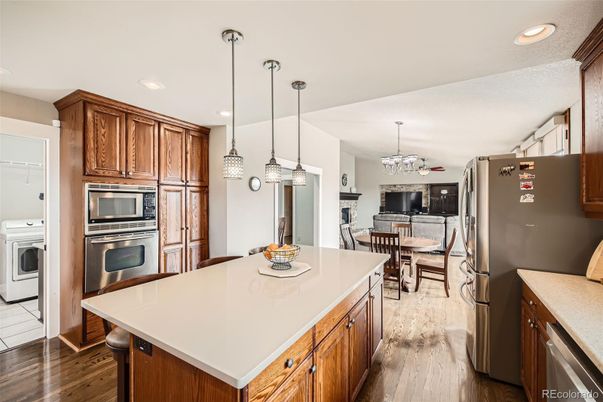 Chandelier, Dining room, Interior, Kitchen, Pendant Lights, Recessed Lighting, Stainless Steel Appliances, Wood Texture Flooring