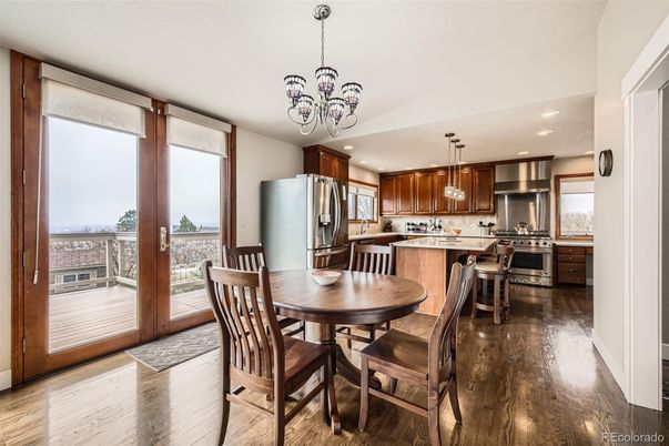 Chandelier, Dining room, Interior, Kitchen, Pendant Lights, Recessed Lighting, Stainless Steel Appliances, Wood Texture Flooring