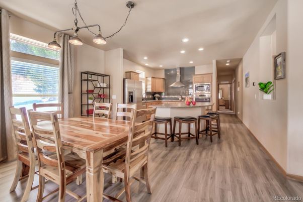 Dining room, Interior, Kitchen, Pendant Lights, Recessed Lighting, Stainless Steel Appliances, Wood Texture Flooring