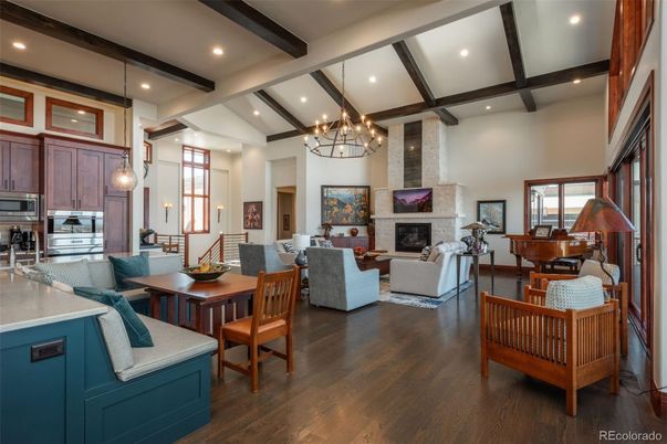 Chandelier, Dining room, Fireplace, Interior, Kitchen, Living room, Recessed Lighting, Stone Walls, Wooden Beams, Wood Texture Flooring
