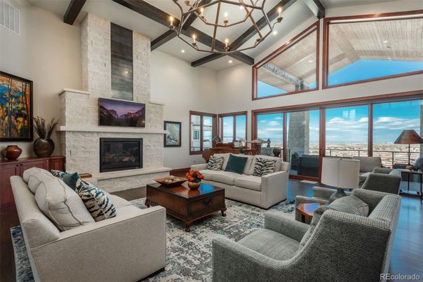 Chandelier, Dining room, Fireplace, Interior, Living room, Recessed Lighting, Stone Walls, Wooden Beams, Wood Texture Flooring