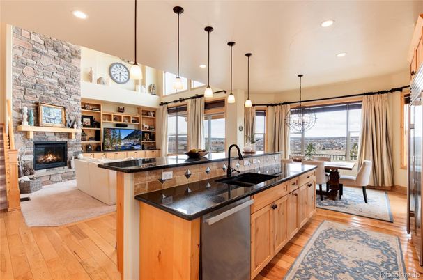 Dining room, Fireplace, Interior, Kitchen, Living room, Pendant Lights, Recessed Lighting, Stainless Steel Appliances, Stone Walls, Wood Texture Flooring