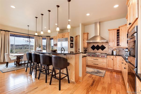 Dining room, Interior, Kitchen, Pendant Lights, Recessed Lighting, Stainless Steel Appliances, Wood Texture Flooring