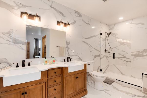 Bathroom, Dual Sink Vanities, Glass Shower, Interior, Marble, Marble Walls, Recessed Lighting