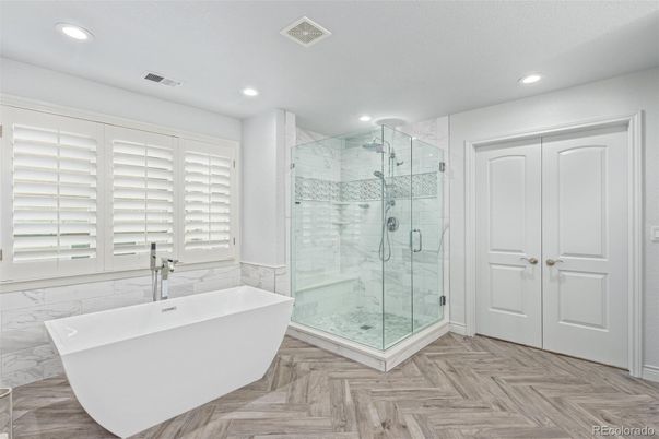 Bathroom, Free Standing Baths, Glass Shower, Interior, Marble, Marble Walls, Recessed Lighting, Wood Texture Flooring