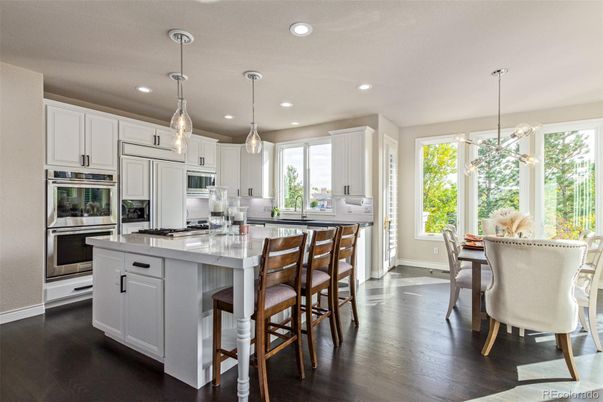 Dining room, Interior, Kitchen, Pendant Lights, Recessed Lighting, Stainless Steel Appliances, Wood Texture Flooring