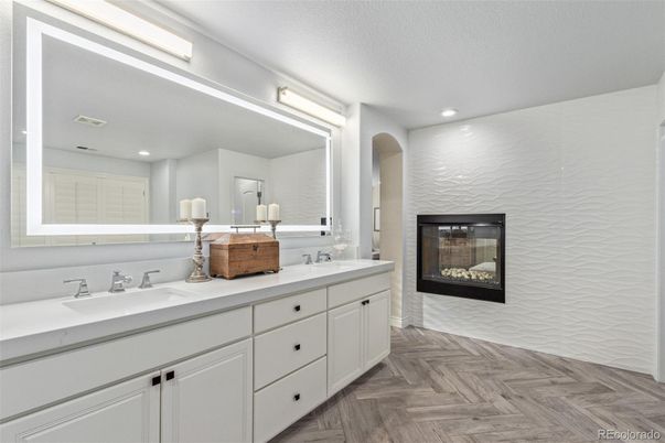 Bathroom, Dual Sink Vanities, Fireplace, Interior, Recessed Lighting, Wood Texture Flooring