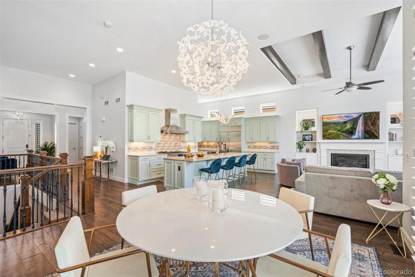 Chandelier, Dining room, Fireplace, Interior, Kitchen, Living room, Pendant Lights, Recessed Lighting, Stainless Steel Appliances, Wood Texture Flooring