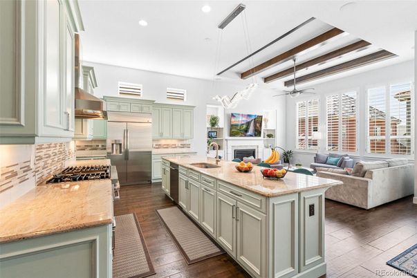 Fireplace, Interior, Kitchen, Living room, Pendant Lights, Recessed Lighting, Stainless Steel Appliances, Wood Texture Flooring