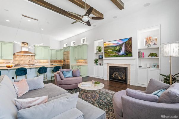 Fireplace, Interior, Kitchen, Living room, Pendant Lights, Recessed Lighting, Stainless Steel Appliances, Wooden Beams, Wood Texture Flooring