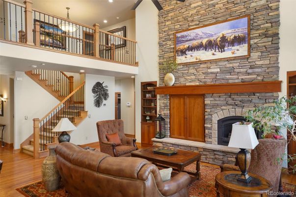 Fireplace, Interior, Living room, Recessed Lighting, Stone Walls, Wood Texture Flooring