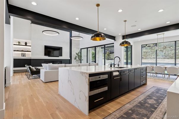 Dining room, Fireplace, Interior, Kitchen, Living room, Pendant Lights, Recessed Lighting, Stainless Steel Appliances, Wood Texture Flooring