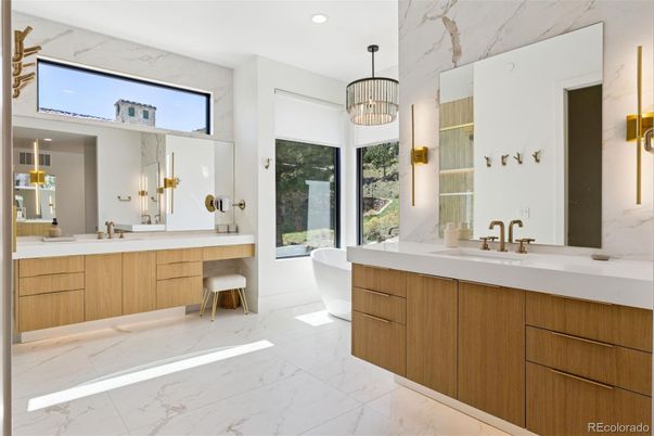 Bathroom, Dual Sink Vanities, Free Standing Baths, Interior, Marble, Marble Walls, Pendant Lights, Recessed Lighting