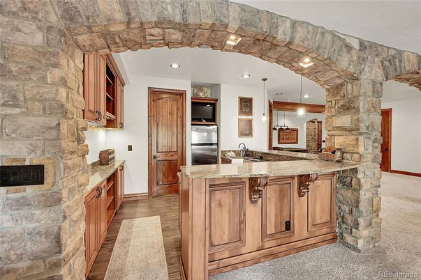 Interior, Kitchen, Pendant Lights, Recessed Lighting, Stainless Steel Appliances, Stone Walls, Wood Texture Flooring