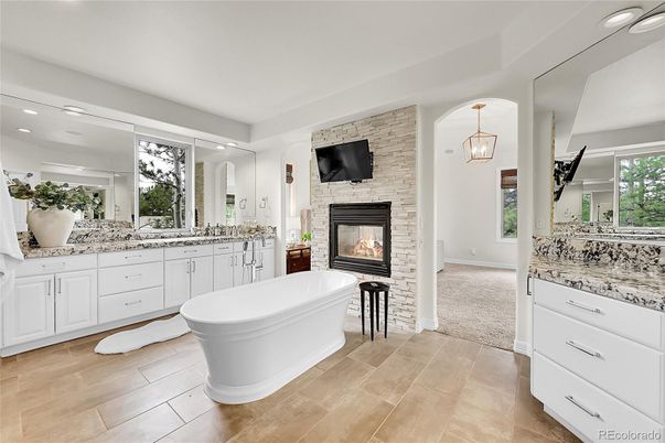 Bathroom, Dual Sink Vanities, Fireplace, Free Standing Baths, Interior, Pendant Lights, Recessed Lighting, Stone Walls, Wood Texture Flooring