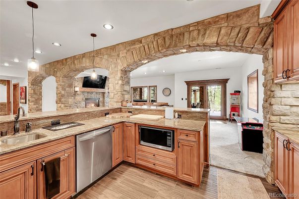 Fireplace, Interior, Kitchen, Pendant Lights, Recessed Lighting, Stone Walls, Wood Texture Flooring