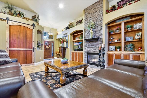 Fireplace, Interior, Pendant Lights, Recessed Lighting, Stone Walls, Wood Texture Flooring