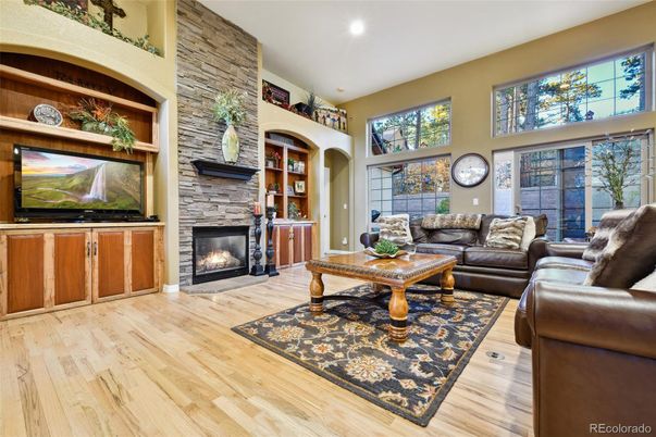 Fireplace, Interior, Living room, Recessed Lighting, Stone Walls, Wood Texture Flooring