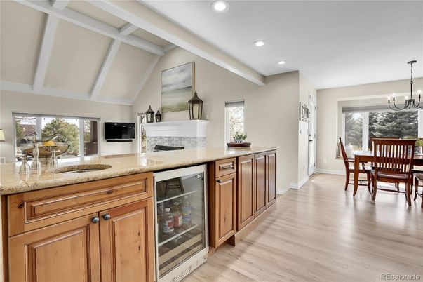 Chandelier, Dining room, Fireplace, Interior, Kitchen, Recessed Lighting, Wood Texture Flooring