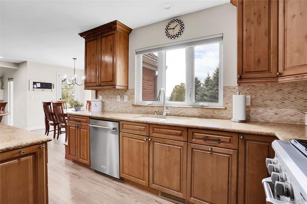 Chandelier, Dining room, Interior, Kitchen, Pendant Lights, Recessed Lighting, Stainless Steel Appliances, Wood Texture Flooring