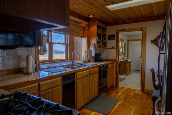 Interior, Kitchen, Recessed Lighting, Tile Countertops, Wooden Ceilings, Wood Texture Flooring