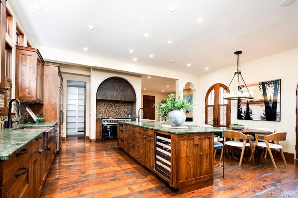 Chandelier, Dining room, Interior, Kitchen, Pendant Lights, Recessed Lighting, Stainless Steel Appliances, Wood Texture Flooring