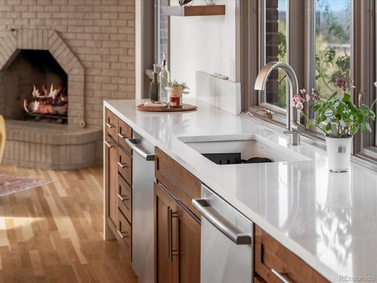 Fireplace, Interior, Kitchen, Stainless Steel Appliances, Stone Walls, Wood Texture Flooring