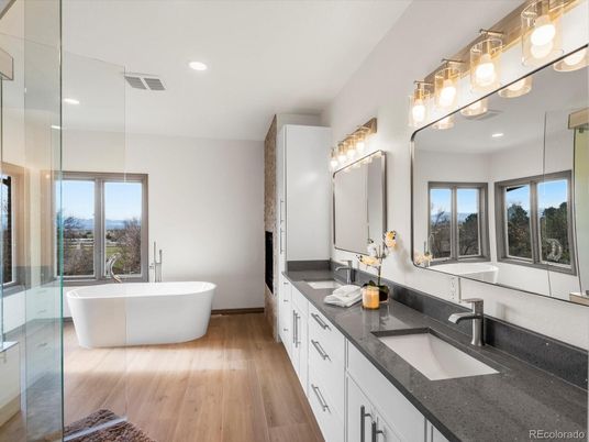Bathroom, Dual Sink Vanities, Free Standing Baths, Glass Shower, Interior, Recessed Lighting, Wood Texture Flooring