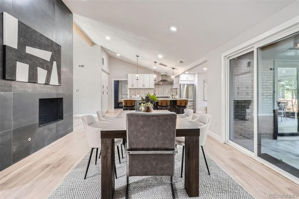 Dining room, Fireplace, Interior, Kitchen, Pendant Lights, Recessed Lighting, Stainless Steel Appliances, Wood Texture Flooring