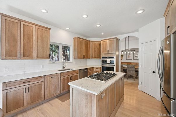 Dining room, Interior, Kitchen, Pendant Lights, Recessed Lighting, Stainless Steel Appliances, Wood Texture Flooring