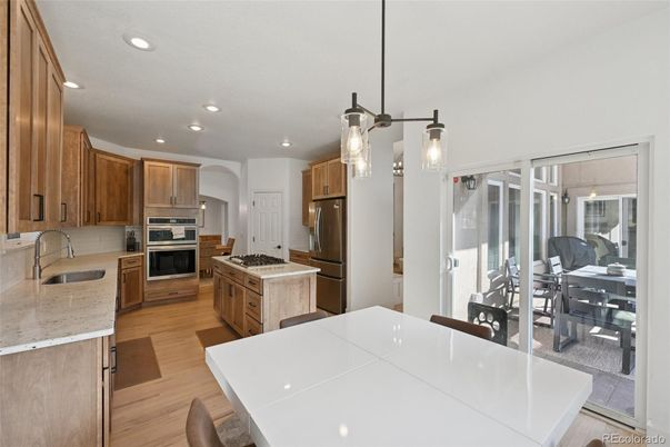 Dining room, Interior, Kitchen, Pendant Lights, Recessed Lighting, Stainless Steel Appliances, Wood Texture Flooring