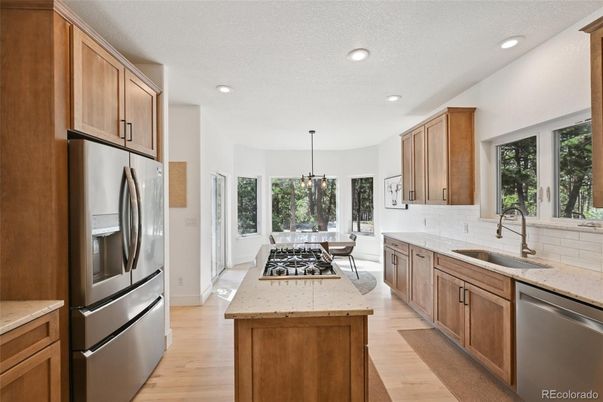 Dining room, Interior, Kitchen, Pendant Lights, Recessed Lighting, Stainless Steel Appliances, Wood Texture Flooring