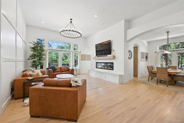 Chandelier, Dining room, Fireplace, Interior, Living room, Pendant Lights, Recessed Lighting, Wood Texture Flooring