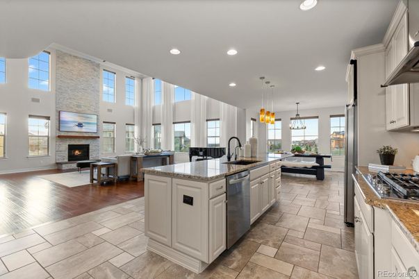 Chandelier, Dining room, Fireplace, Interior, Kitchen, Living room, Pendant Lights, Recessed Lighting, Stainless Steel Appliances, Wood Texture Flooring