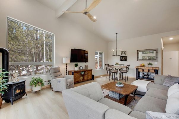 Dining room, Fireplace, Interior, Living room, Pendant Lights, Recessed Lighting, Wood Texture Flooring