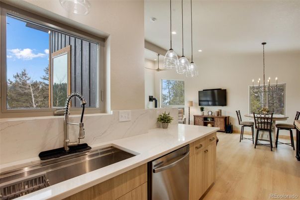 Dining room, Interior, Kitchen, Pendant Lights, Recessed Lighting, Stainless Steel Appliances, Wood Texture Flooring