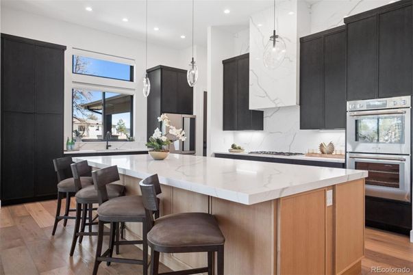 Interior, Kitchen, Marble Walls, Pendant Lights, Recessed Lighting, Stainless Steel Appliances, Wood Texture Flooring