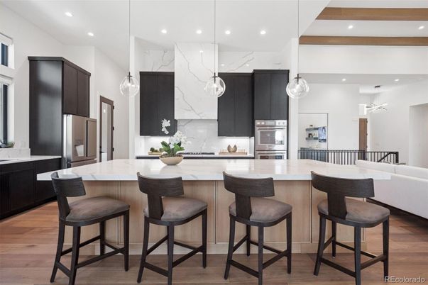 Interior, Kitchen, Marble Walls, Pendant Lights, Recessed Lighting, Stainless Steel Appliances, Wood Texture Flooring
