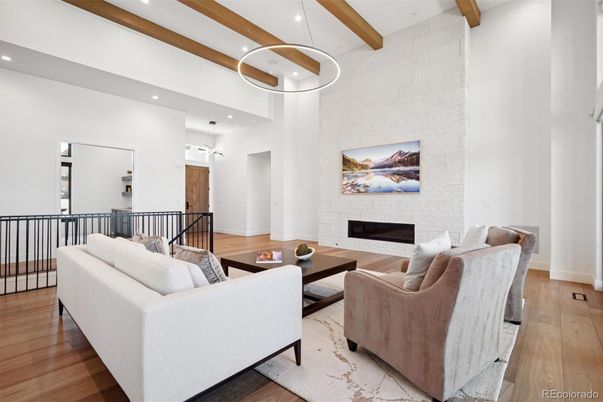 Fireplace, Interior, Living room, Pendant Lights, Recessed Lighting, Wooden Beams, Wood Texture Flooring